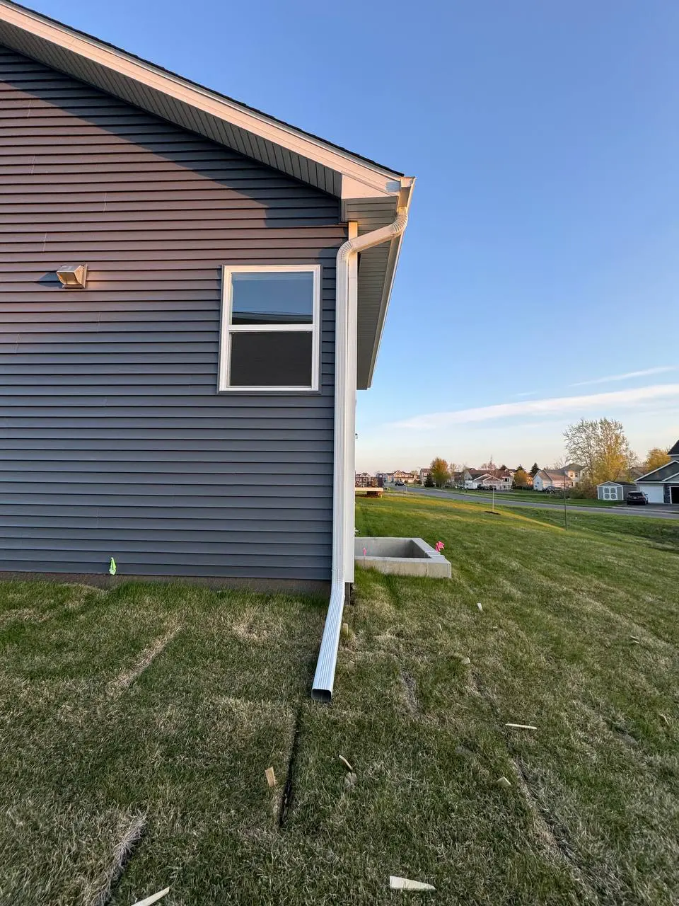 Complete white seamless gutter system on a Waverly MN home