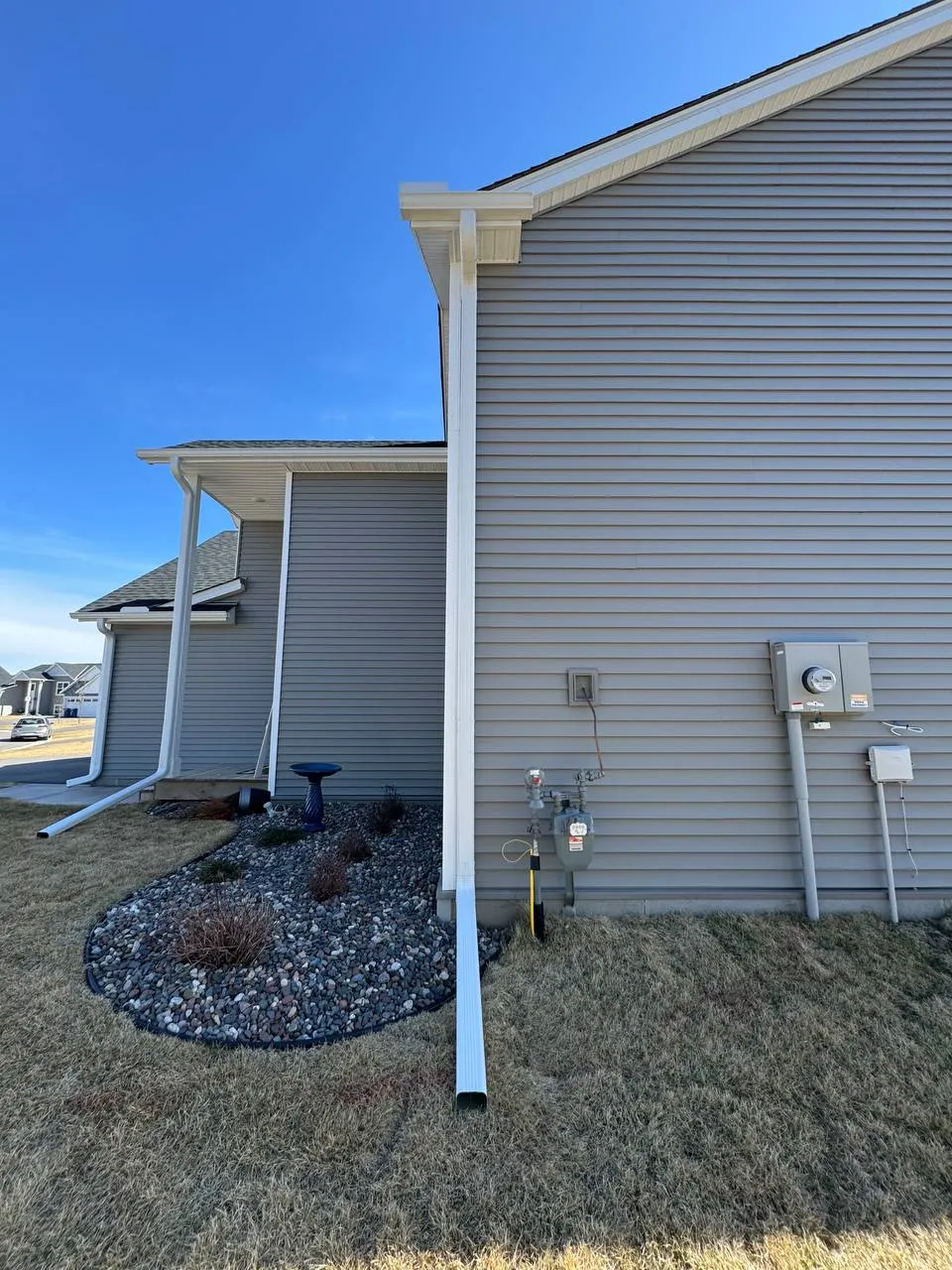 Gutter downspout installation on a residential home in Woodbury MN