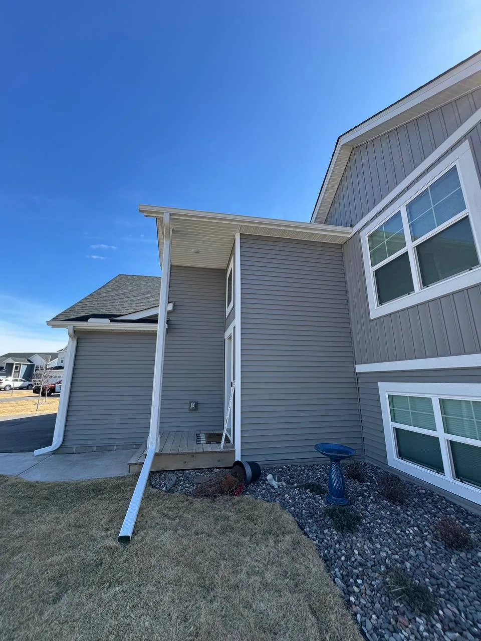 White seamless gutters on a new construction home in Woodbury MN
