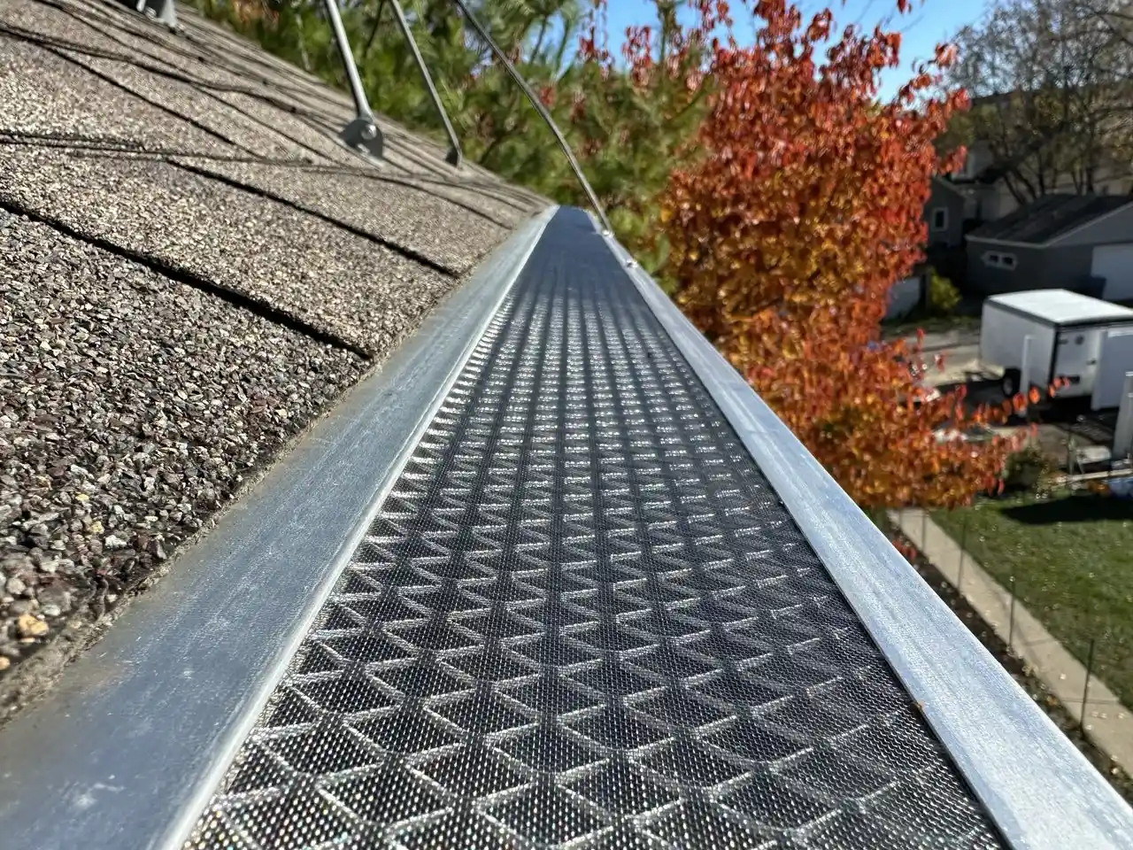 Micro-mesh gutter guard installed during fall season in Maple Grove, MN