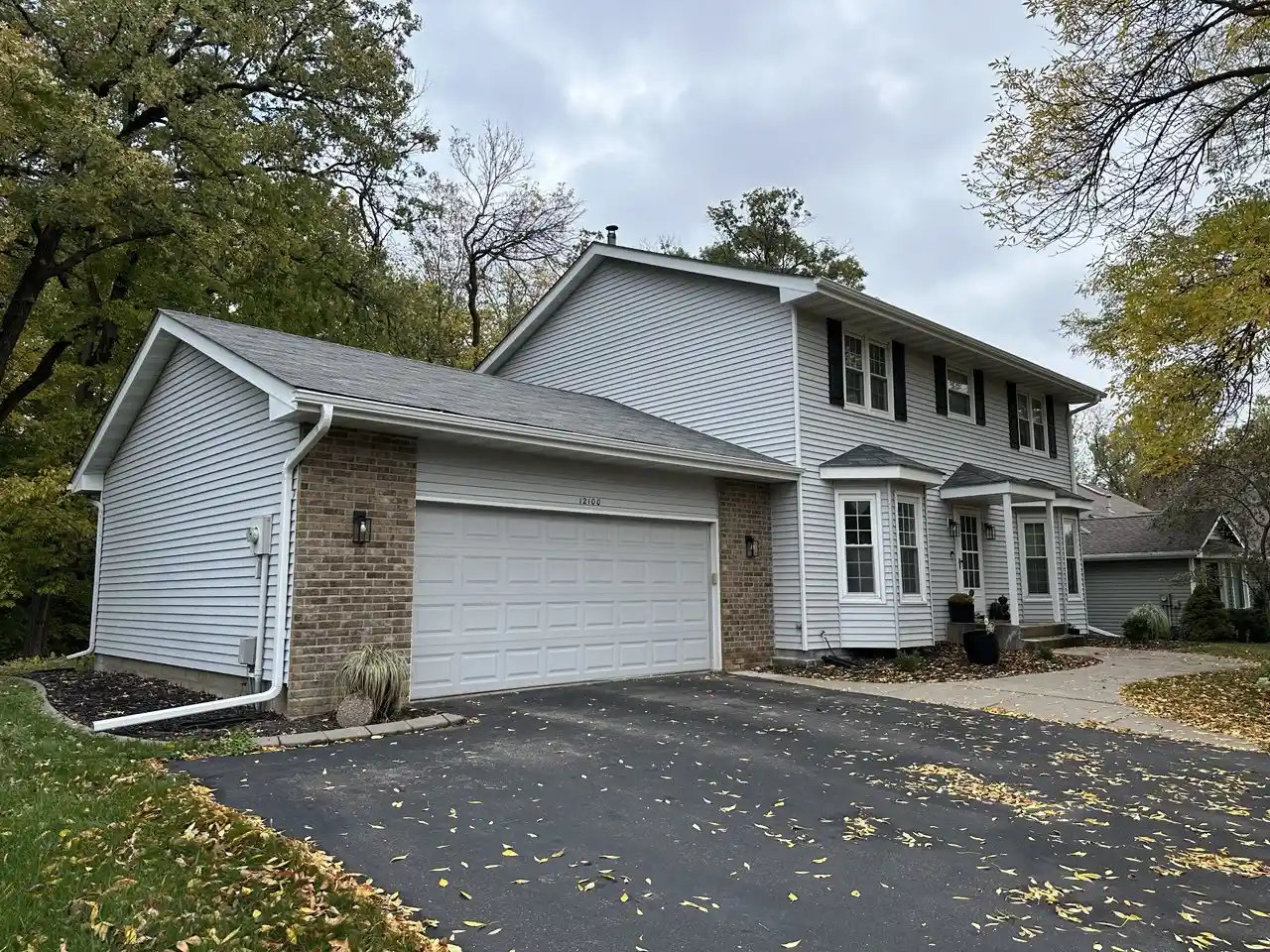 Seamless gutter installation on a two-story home in Plymouth, MN
